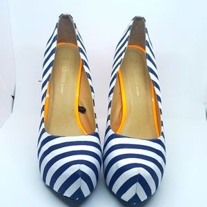 Platform heels with blue striped and neon orange heel.